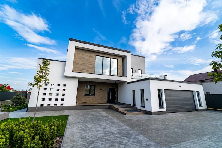 modern luxury house with garage blue sky