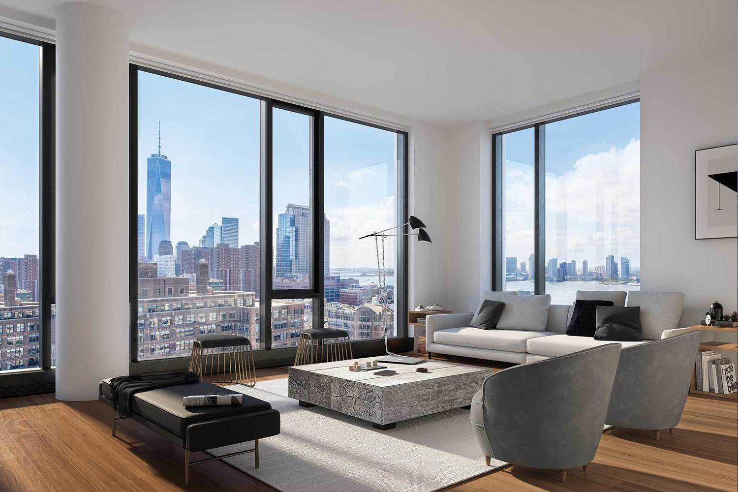 Modern living room with floor-to-ceiling windows overlooking One World Trade Center and the Hudson River.