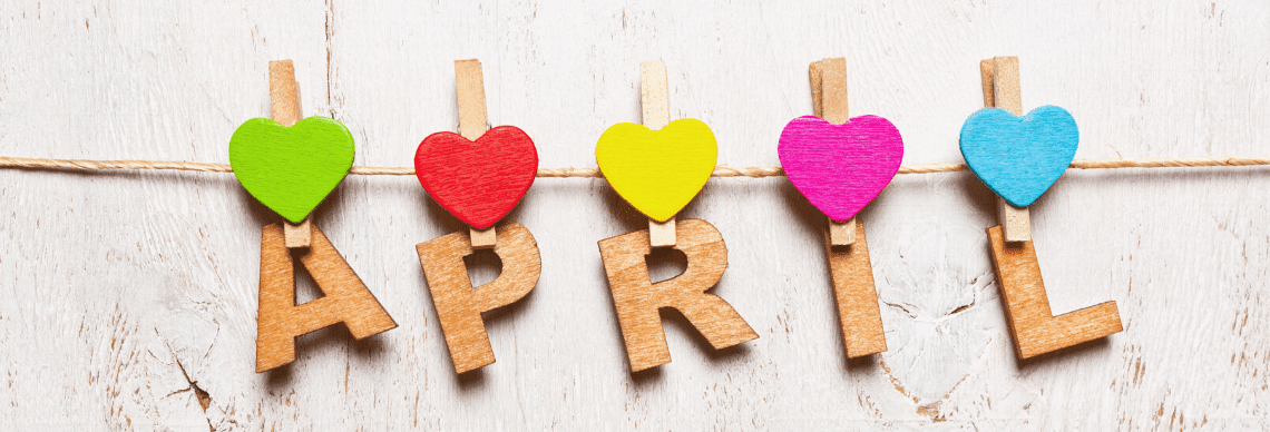  the word "APRIL" using wooden letters and colorful hearts.