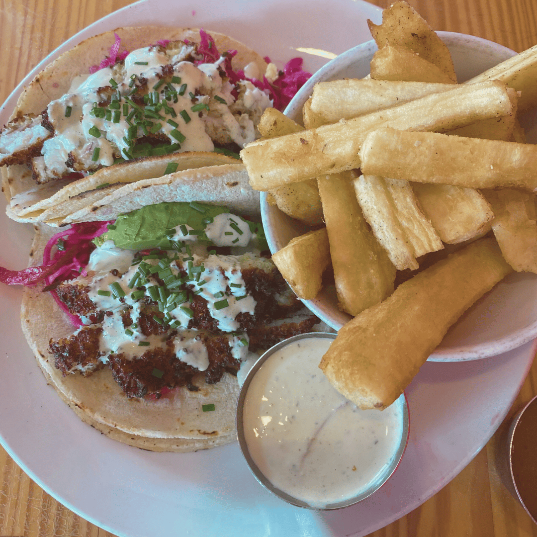 A vibrant spread of tacos paired with golden fries.