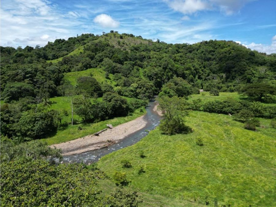 Farm with Mountain Range and River