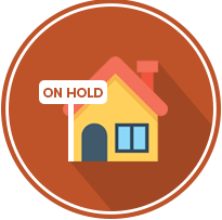 House labeled “ON HOLD”