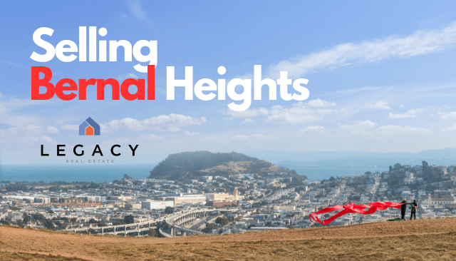 A couple standing on top of Bernal Heights hill holding a red ribbon in the wind