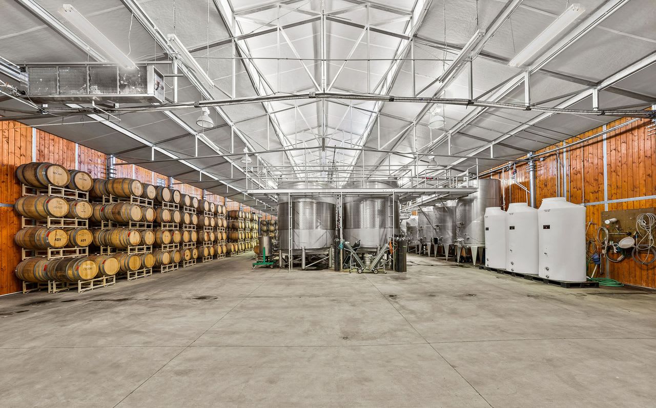 Winery and barrel room on a Los Angeles vineyard property, featuring wine aging facilities.