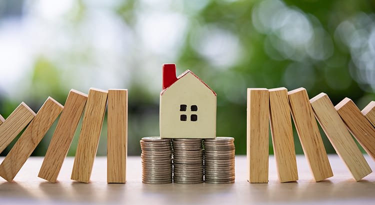  a symbolic representation of financial stability and housing, blending elements of a house, coins, and wooden blocks. 