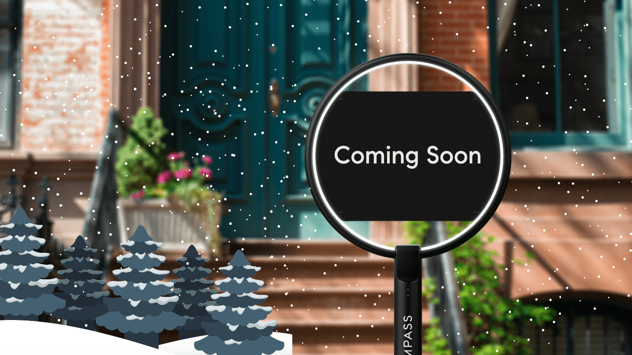Winter home entrance with falling snow and a magnifying glass reading “Coming Soon.”