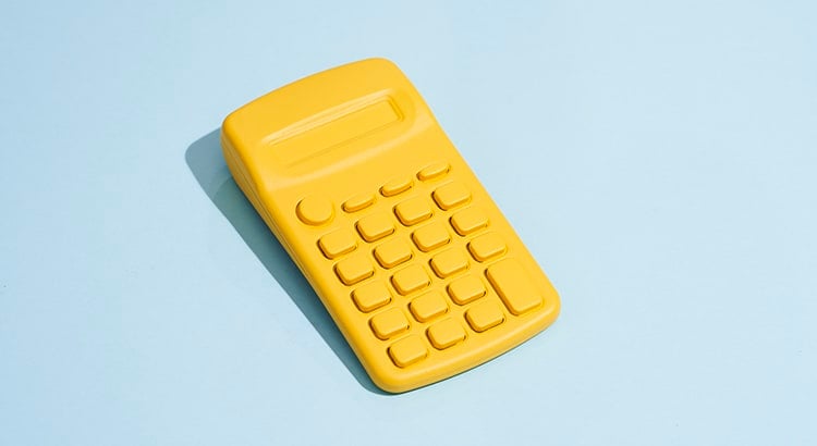 A yellow calculator on a light blue background.