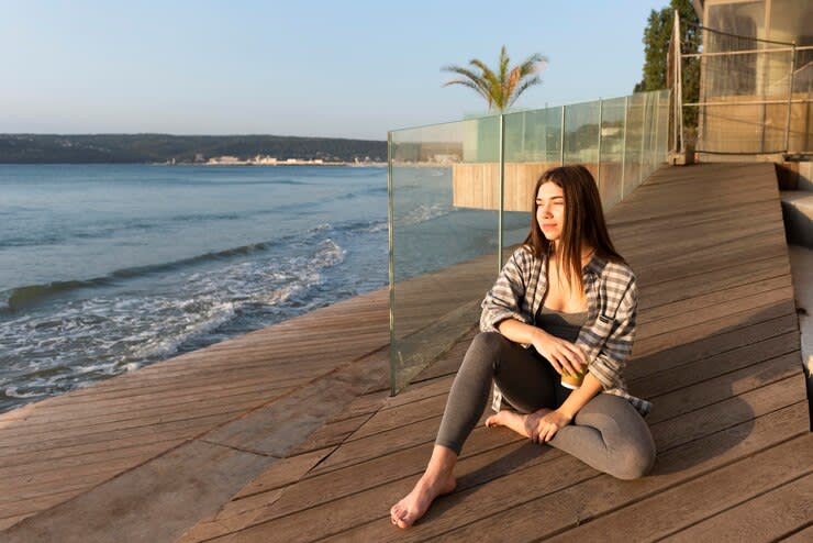 woman sitting on the beach