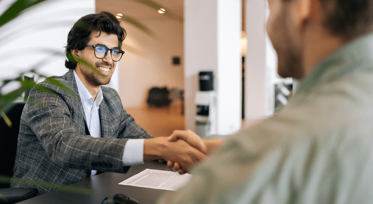 Two business professionals shaking hands