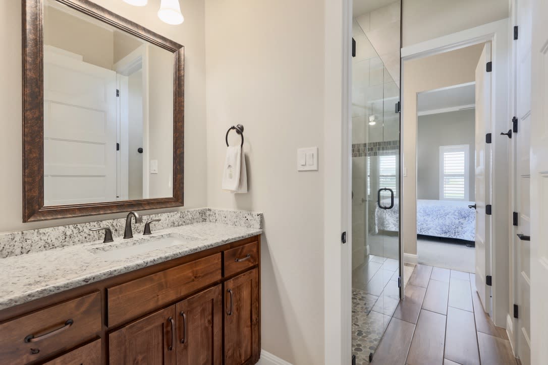 This Jack and Jill layout is perfect for families, allowing siblings or guests to share a bathroom while still maintaining their individuality.