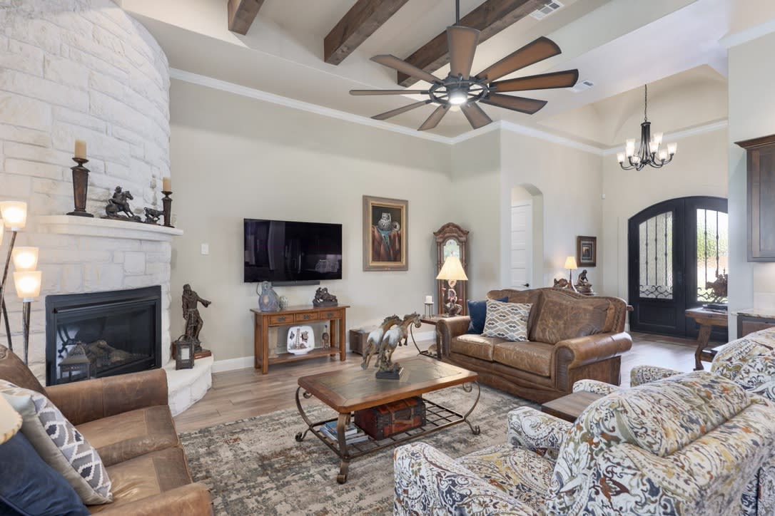 The main living areas feature an open layout, perfect for entertaining guests or spending quality time with family. Whether you're relaxing in the cozy living room, gathering around the dining table for a meal, the interconnected spaces create a sense of warmth and unity.