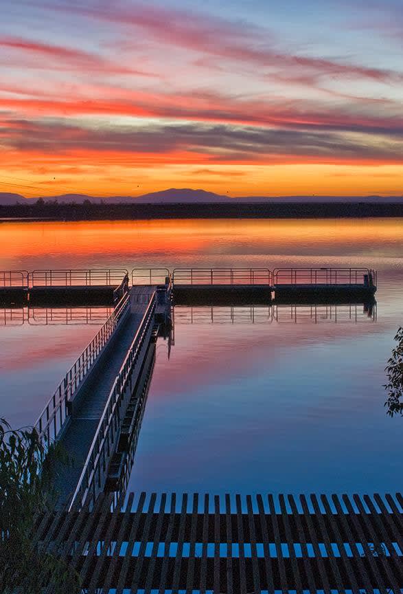 sunset over a lake pier in Blossom Valley San Diego