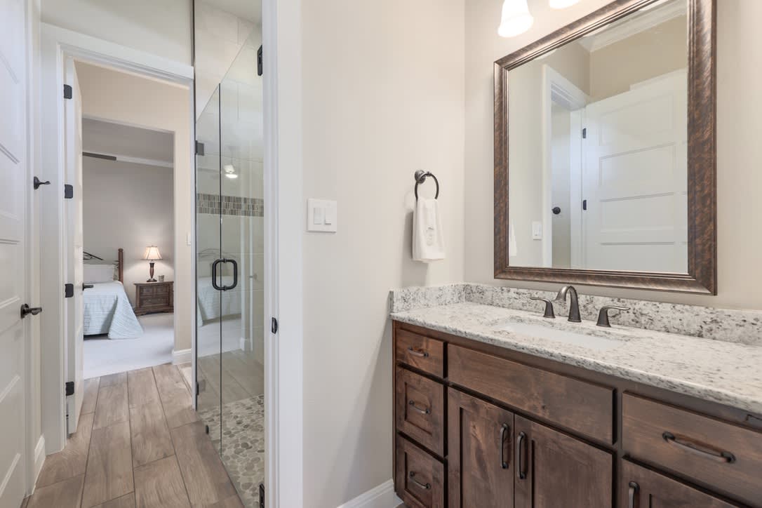 The Jack and Jill bathroom is ingeniously situated between two bedrooms,providing easy access for both without sacrificing personal space.