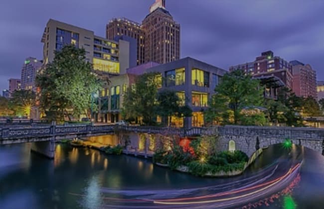 a photo of buildings near the river in Central San Antonio