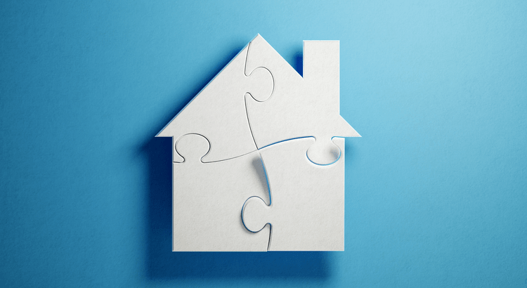 A white house puzzle piece partially assembled in a blue background.