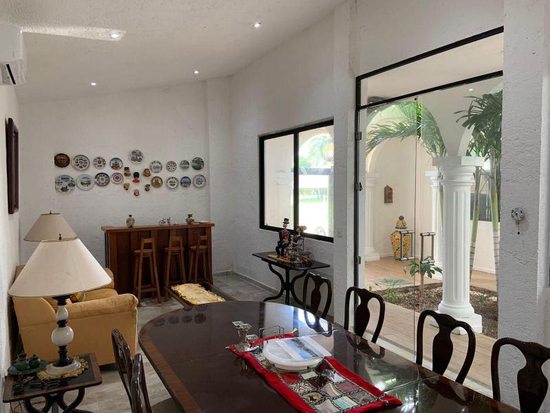 House Can-Can, a captivating residence nestled within the prestigious Cancun Country Club/ Livingroom