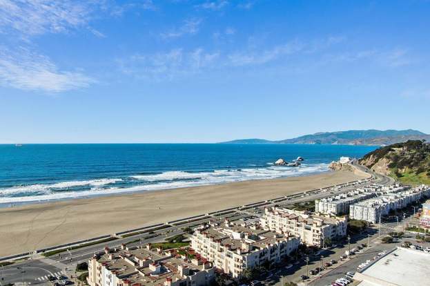 View over La Playa Ocean Beach Condos in the foreground with blue Pacific Ocean in the background