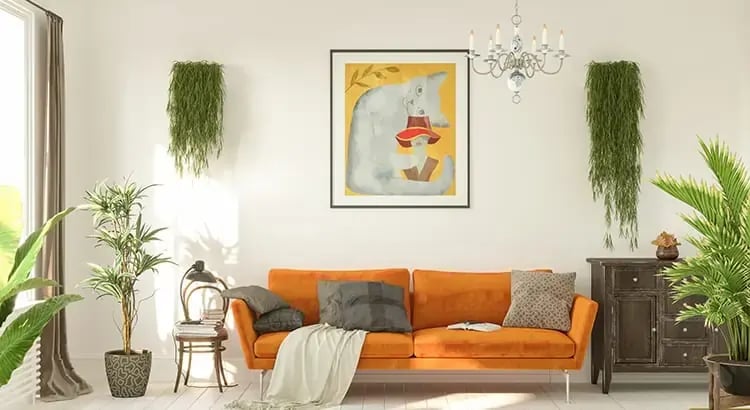 A well-decorated living room with modern furniture, plants, and a chandelier, showcasing interior design or home staging.