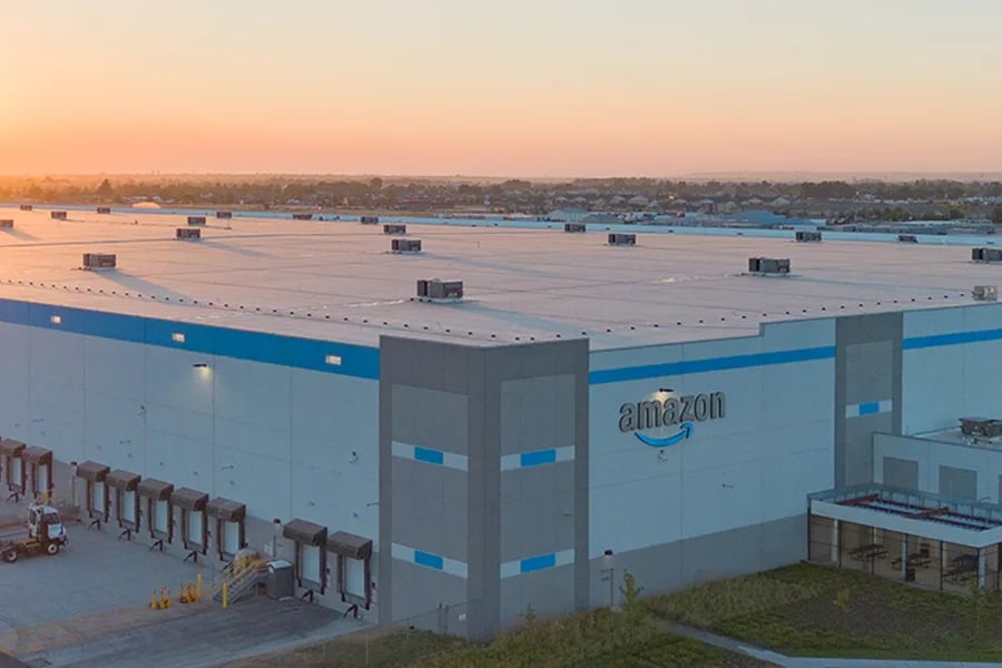 Amazon upping minimum pay, adding other worker benefits 