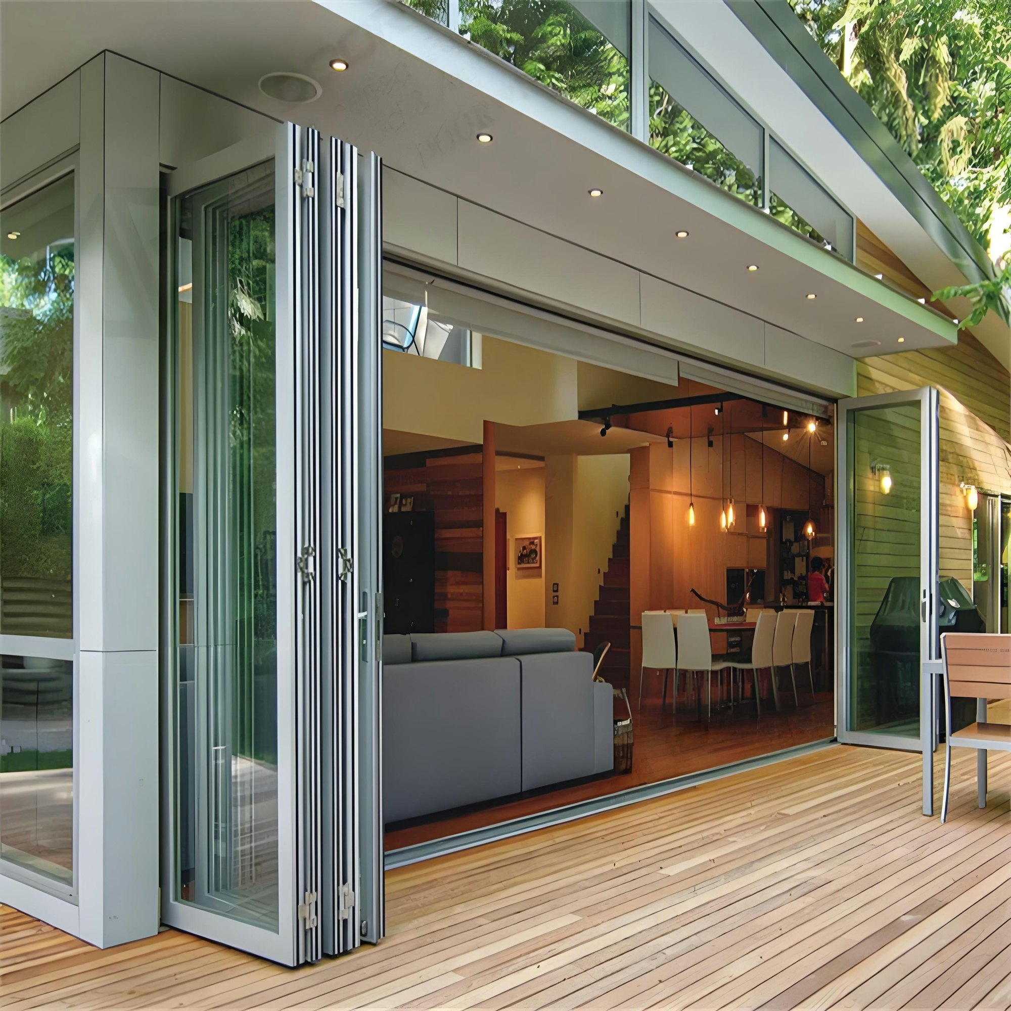 Folding glass doors opening a contemporary interior to an outdoor wood terrace