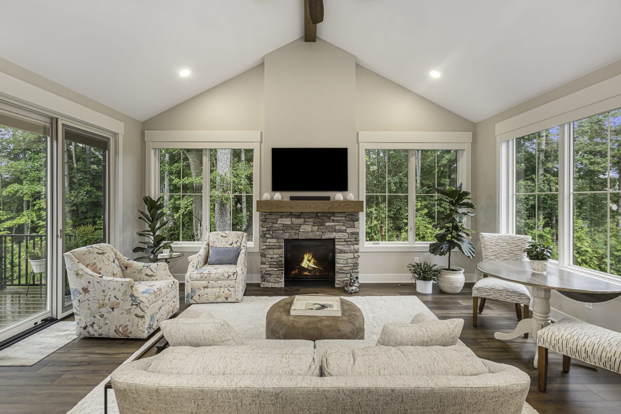 modern living area with couches and fireplace