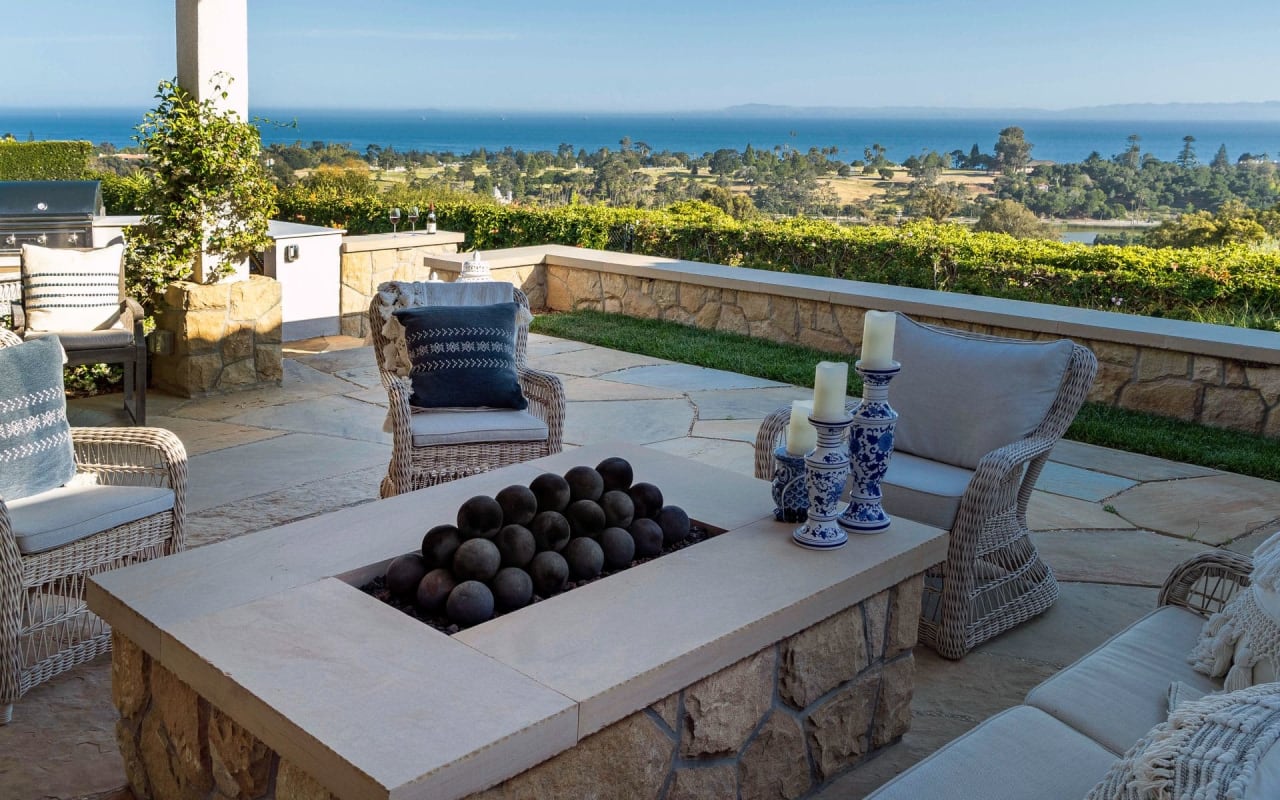 Outdoor Patio with Fire Pit Surrounded by Chairs