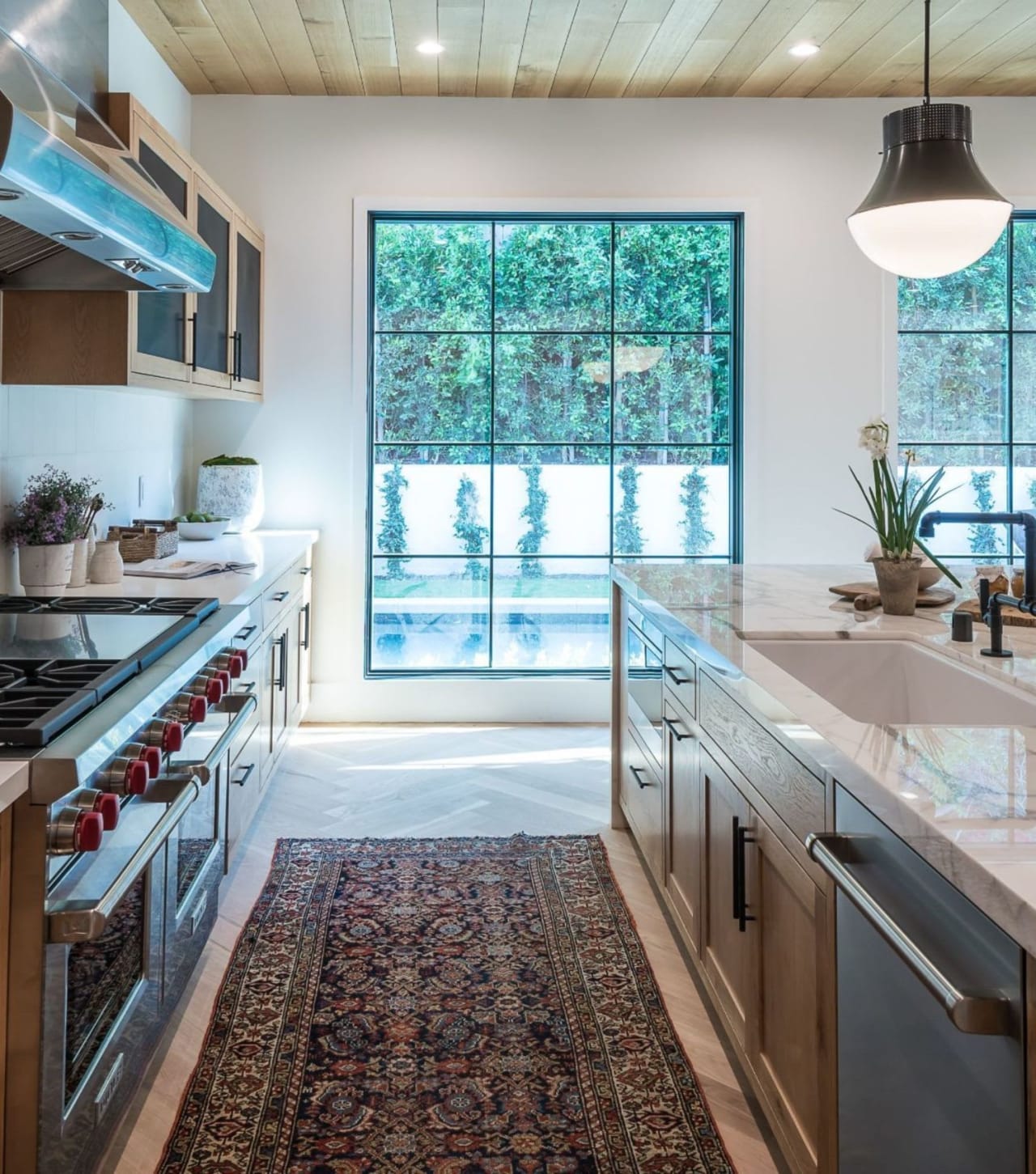 A stainless steel kitchen sink with a faucet and a single basin.