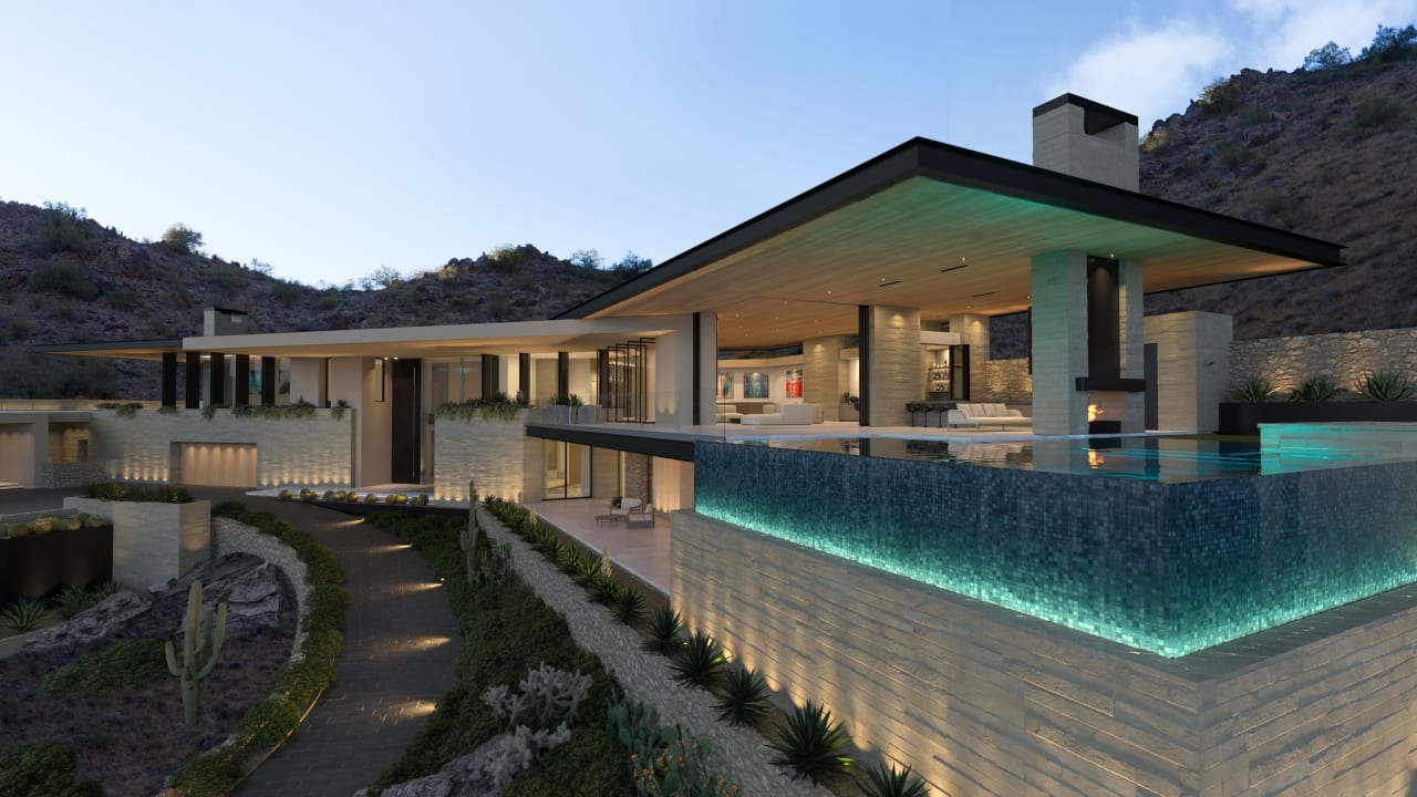 Driveway and elevated corner pool on hillside home