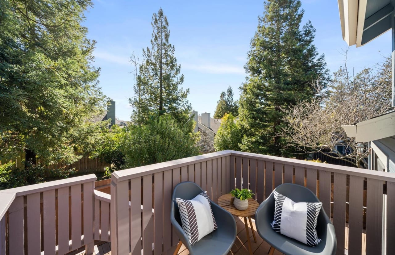 Balcony view with pine trees