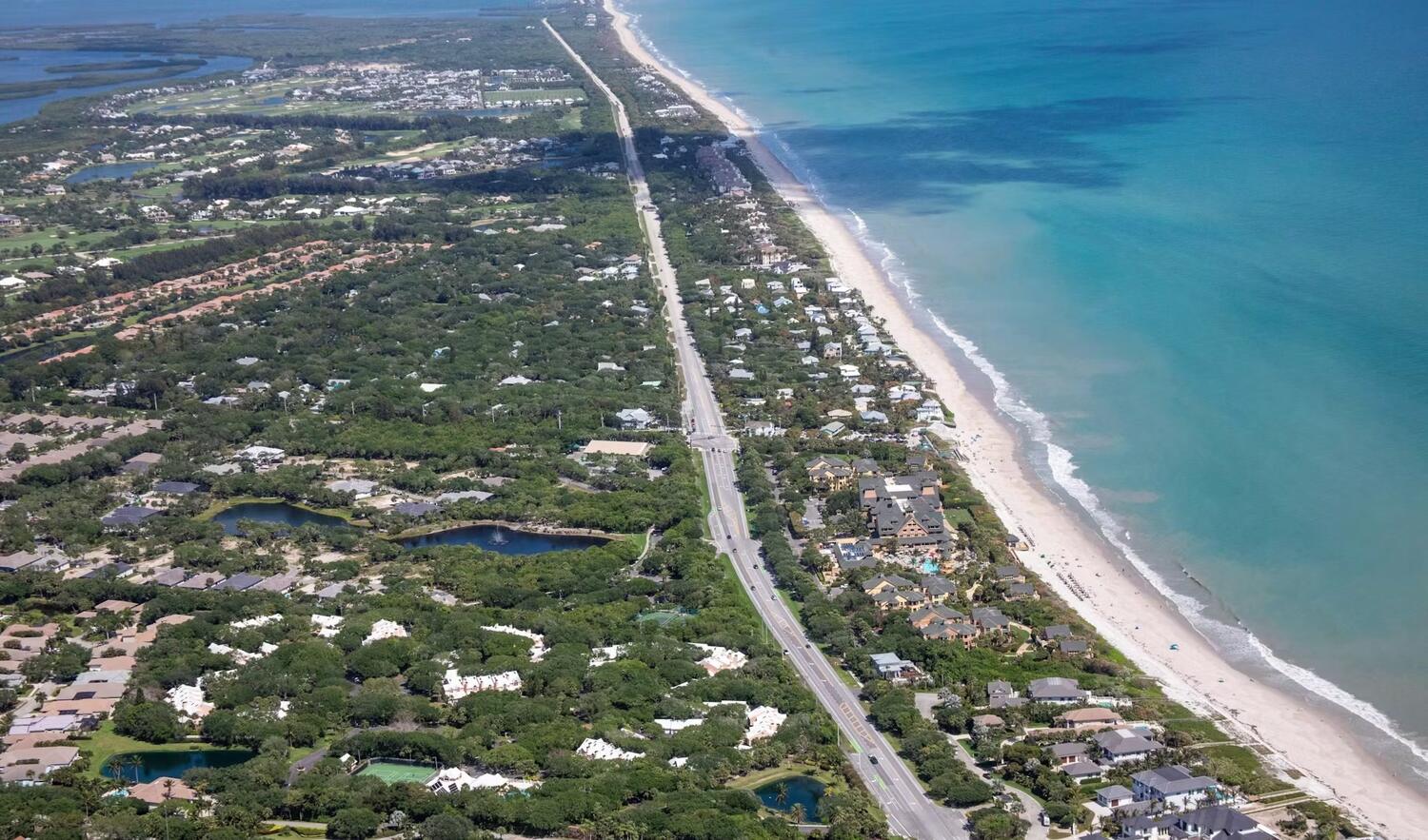 Aerial of oceanfront neighborhoods in Indian River Shores on Vero Beach's barrier island