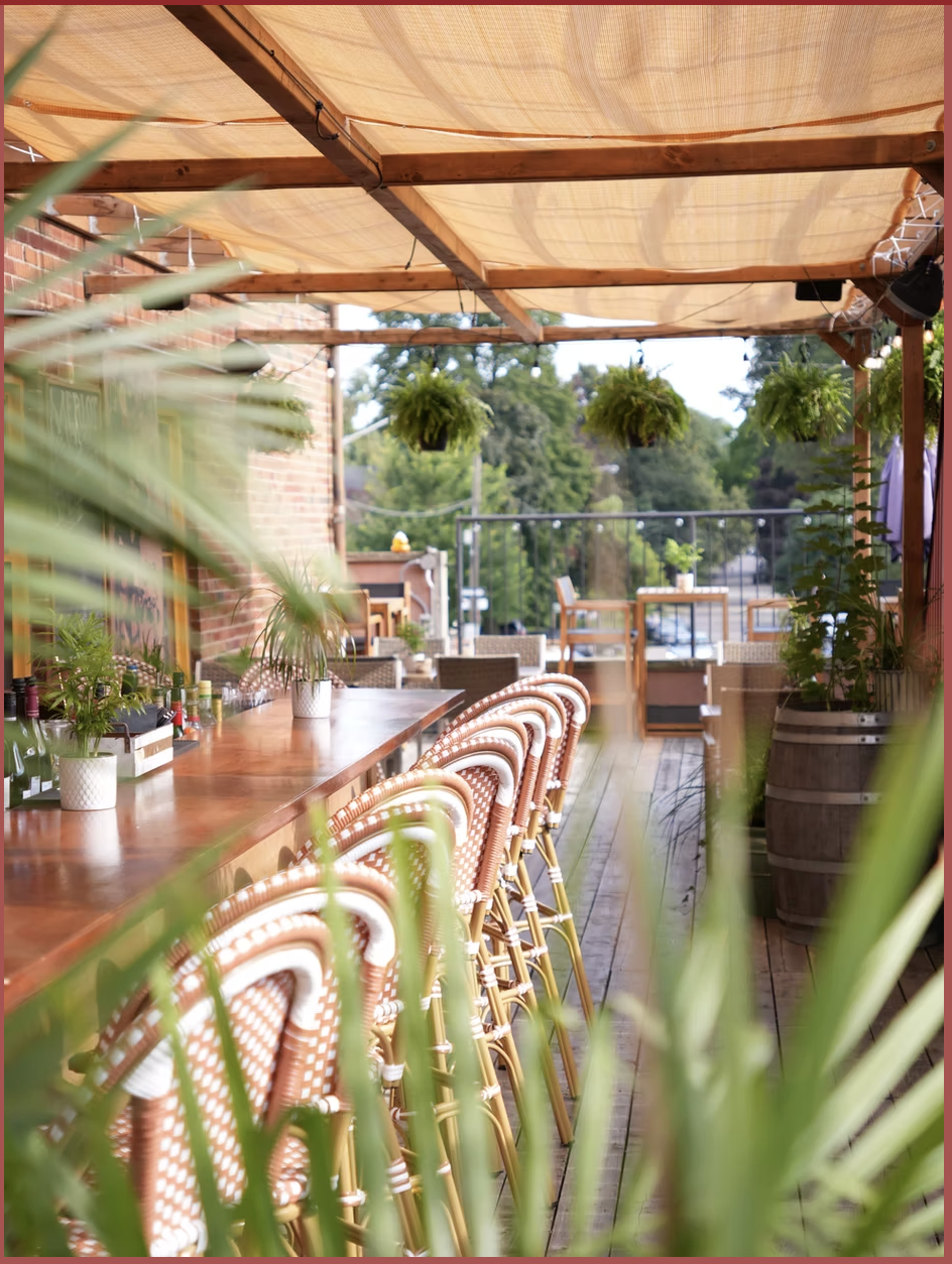 The rooftop patio bar at Merlot on Bloor West with French bistro chairs