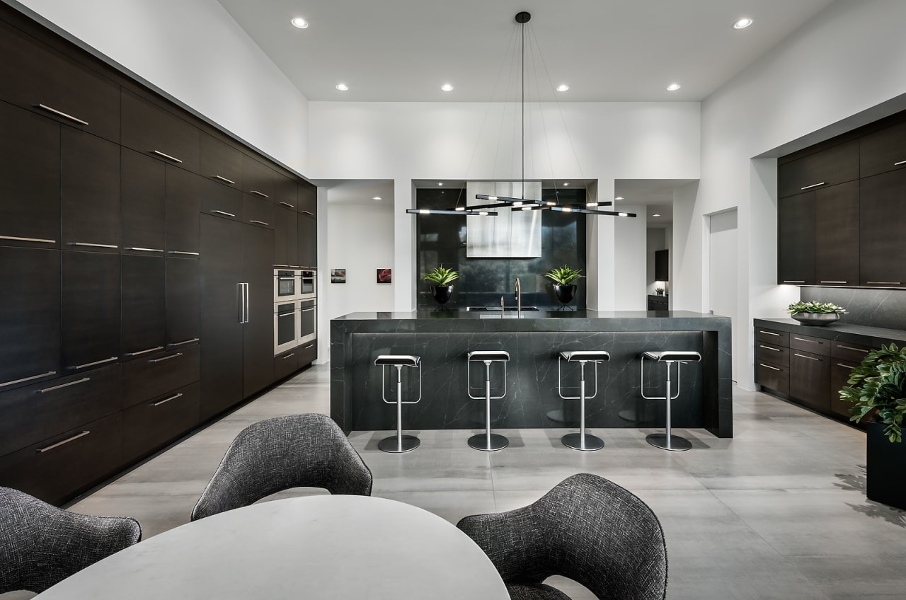 Black modern kitchen with double ovens