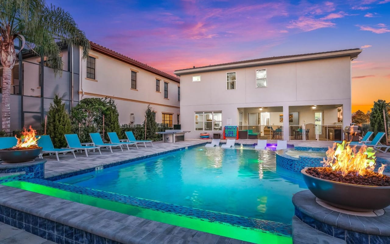 A spacious backyard with a large swimming pool in the center.