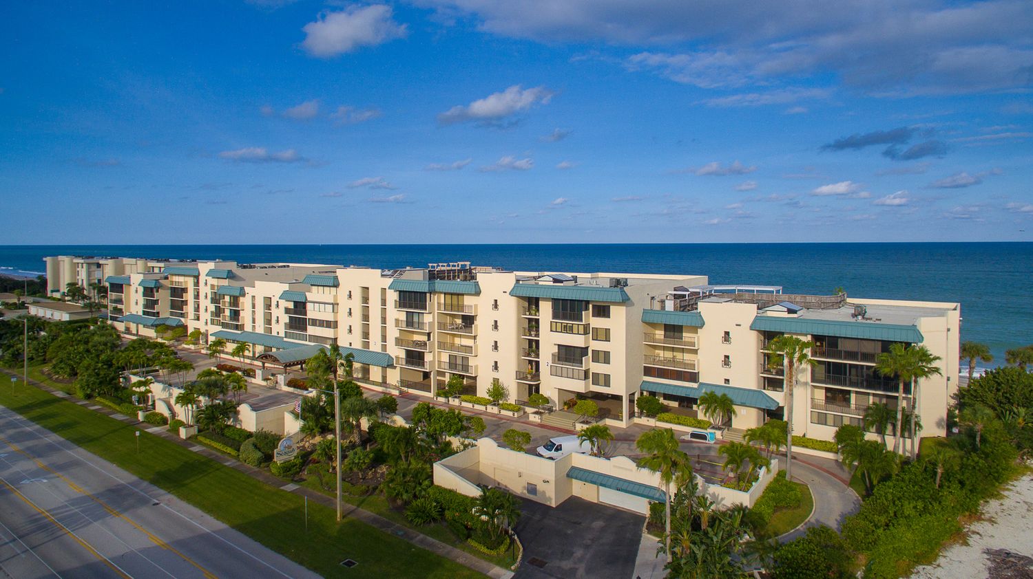 Aerial view of low-rise oceanfront condominiums along A1A on the Vero Beach barrier island