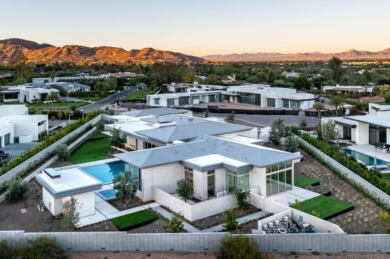 Aerial of modern luxury home with mountain views