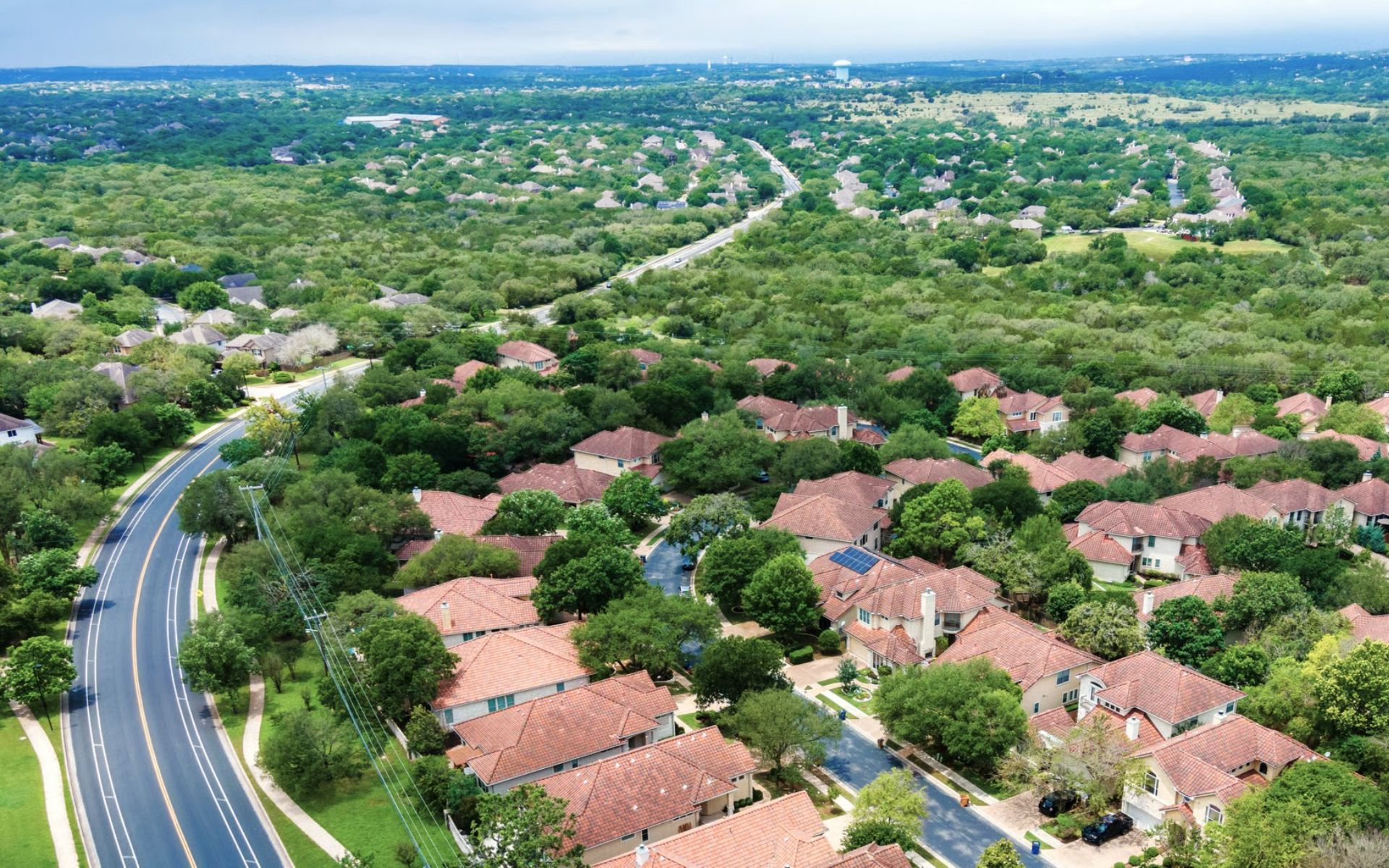 Aerial view of Circle C Ranch homes and greenbelt, Southwest Austin 78739