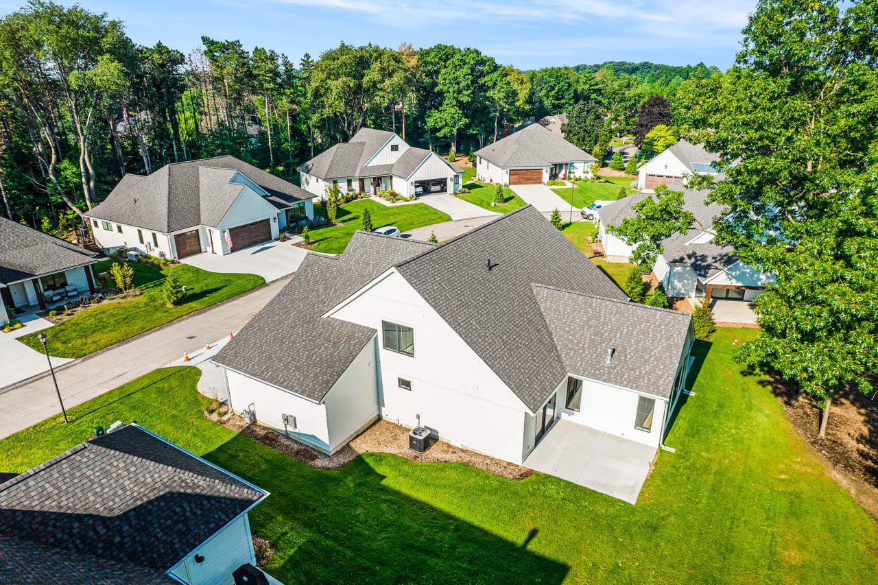 aerial photo of a house surrounded with green lawn