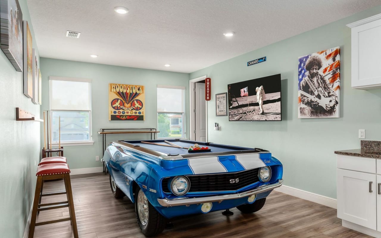 A custom-made pool table shaped like a classic Chevrolet Camaro muscle car.