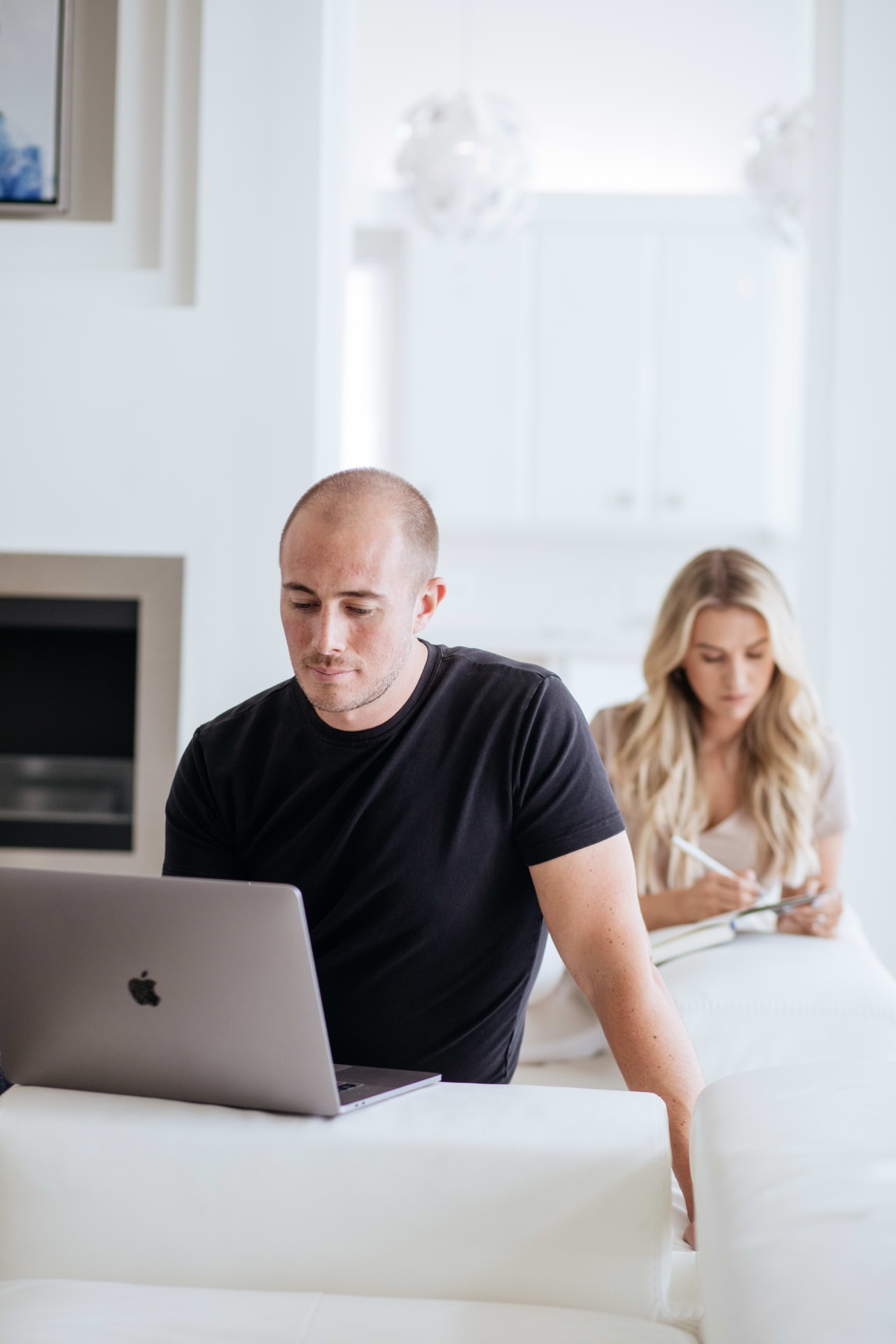 A photo of Ryan Skrzypkowski and Theresa Skrzypkowski busily doing their jobs.