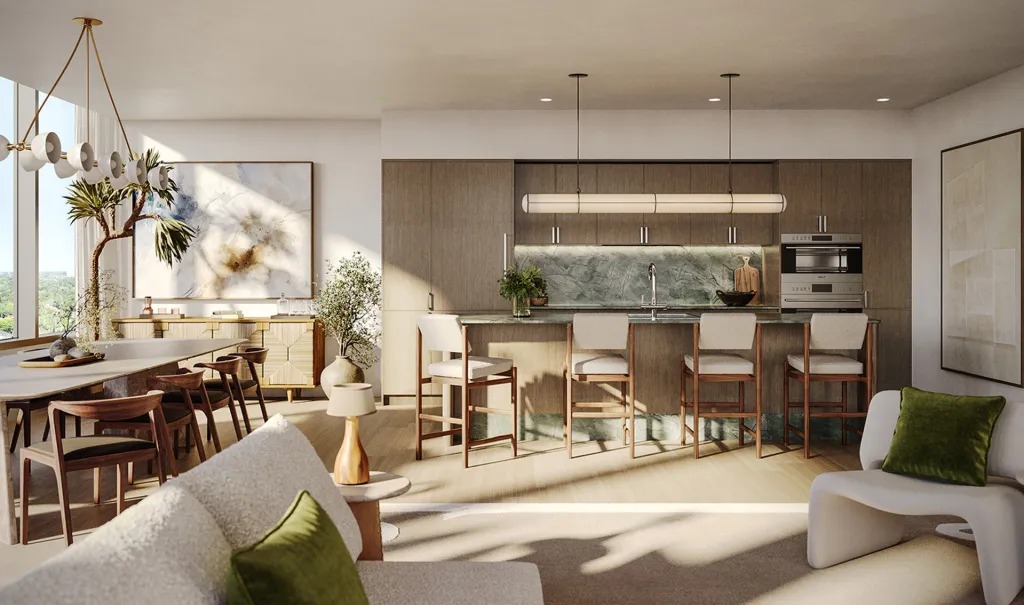 Open-plan kitchen and dining area with wood cabinetry, a stone backsplash, and sunlight streaming through large windows.