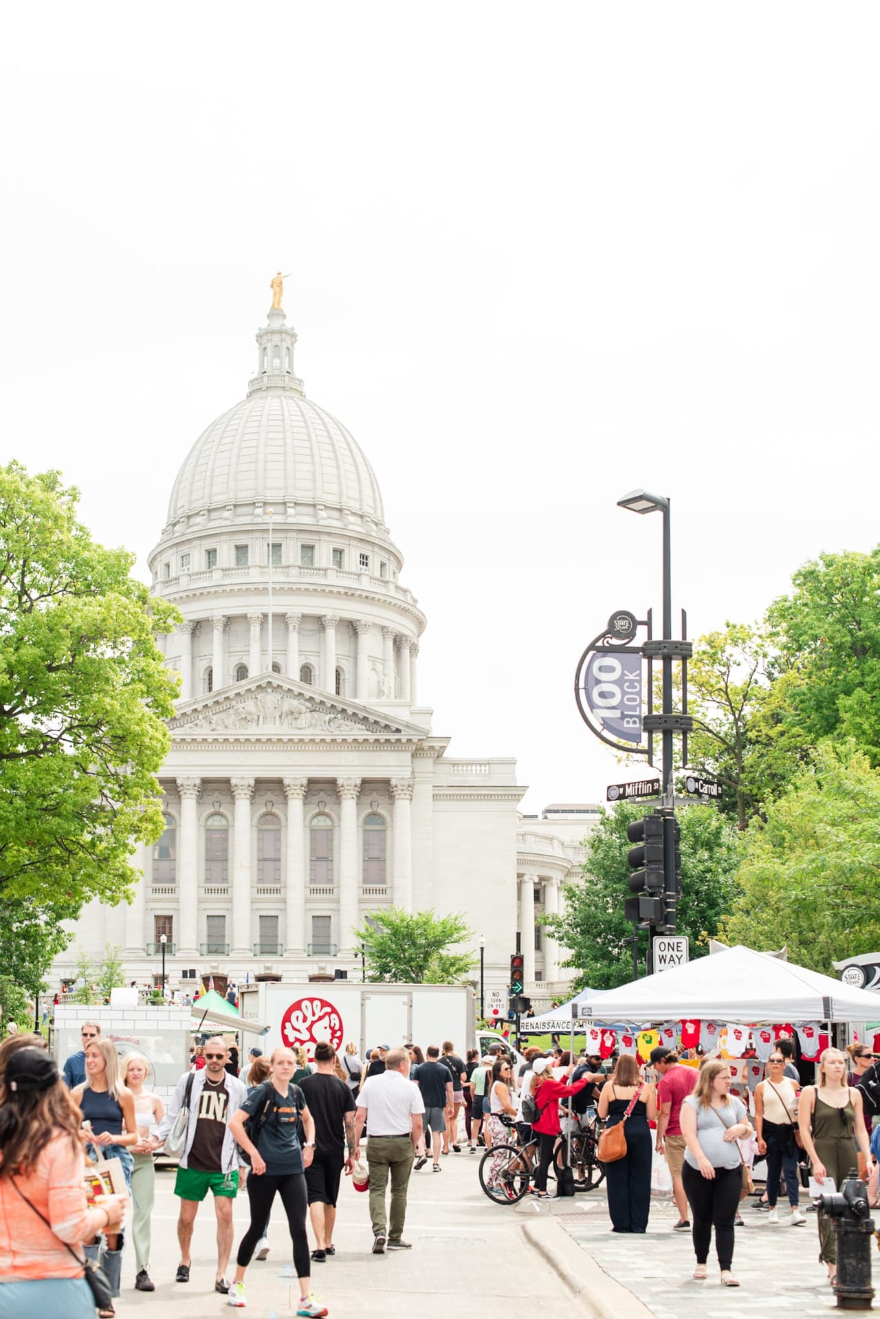 people roaming in front the Wisconsin State Capitol