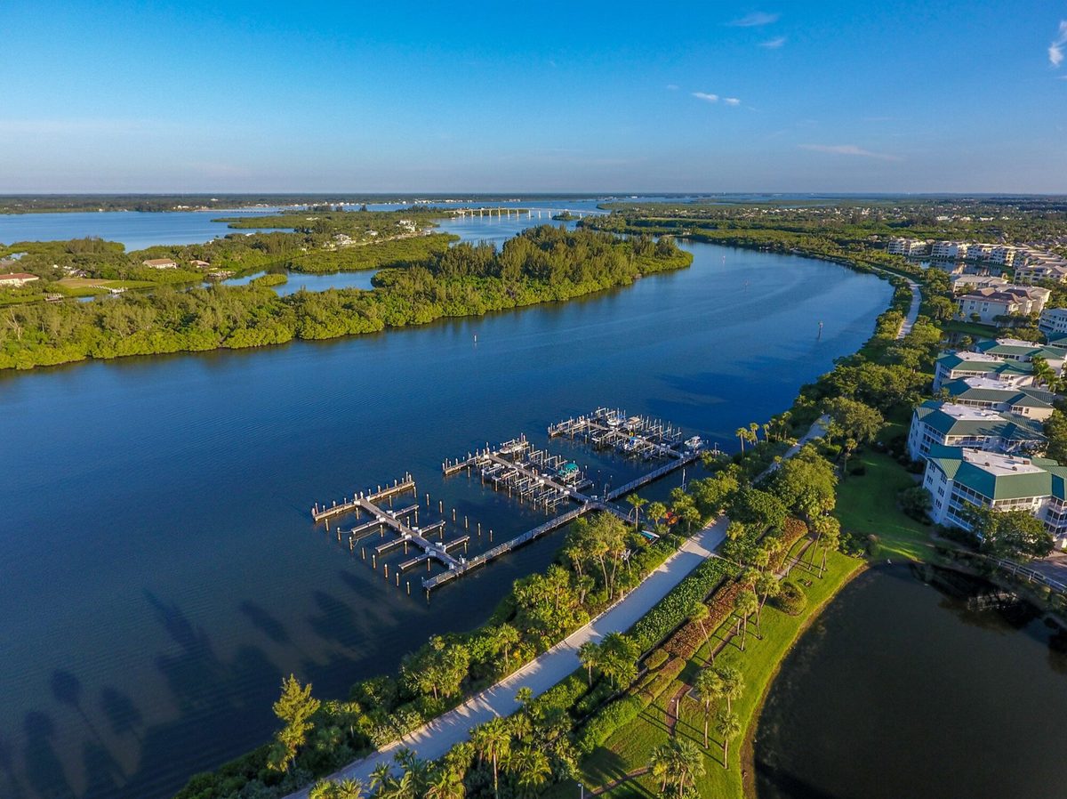 Sea Oaks Vero Beach deep-water marina Indian River Lagoon aerial view — biodiverse estuary waterfront community barrier island conservation character Vero Beach Florida luxury real estate