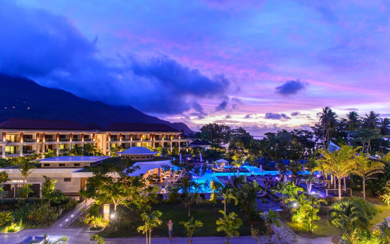 The Savoy Seychelles Resort & Spa, a luxury resort in Alameda, California. The resort has a pool and a private beach.