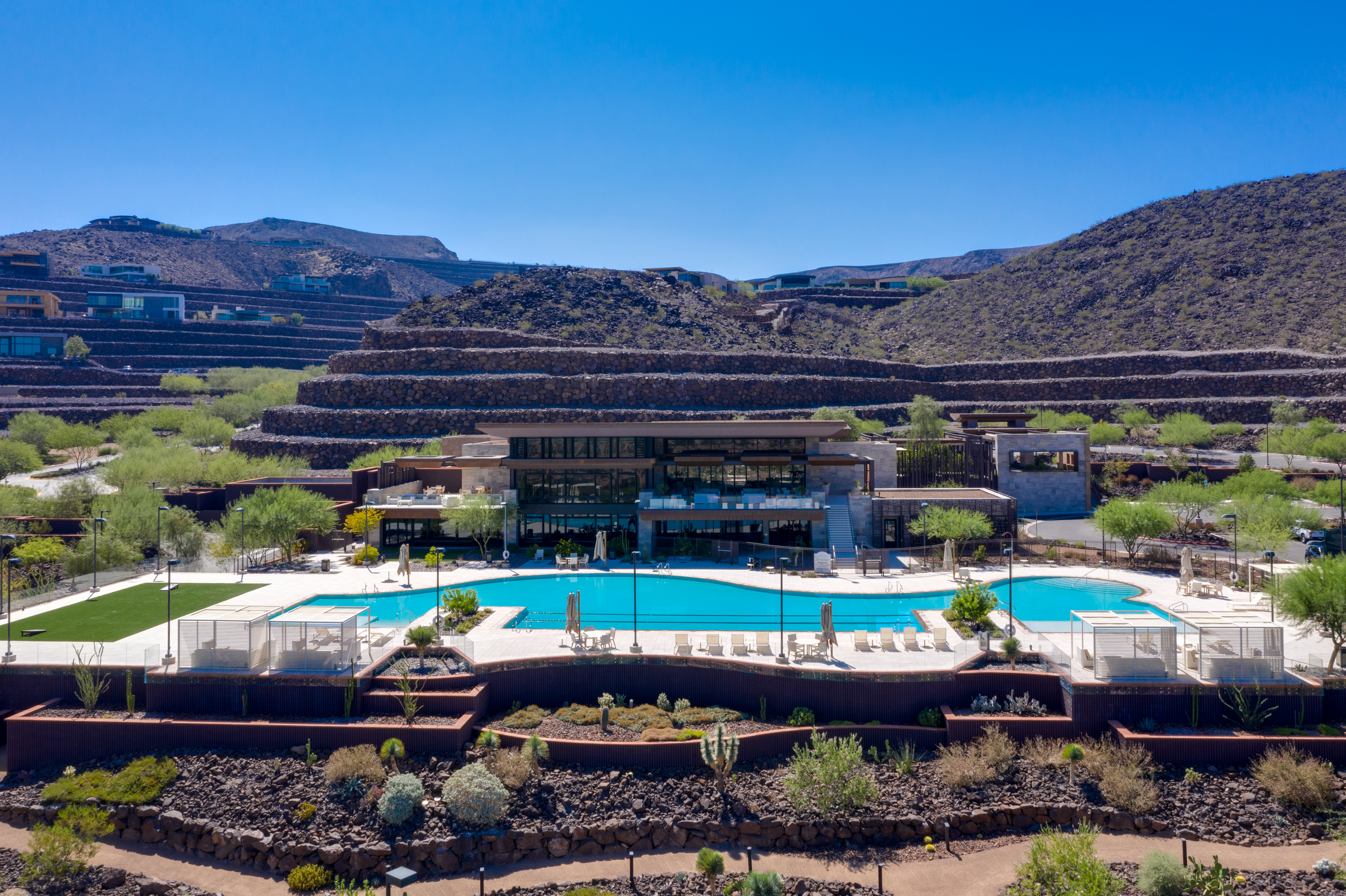 Ascaya clubhouse and zero-edge pool terraced into the McCullough Range desert hillside in Henderson, Nevada