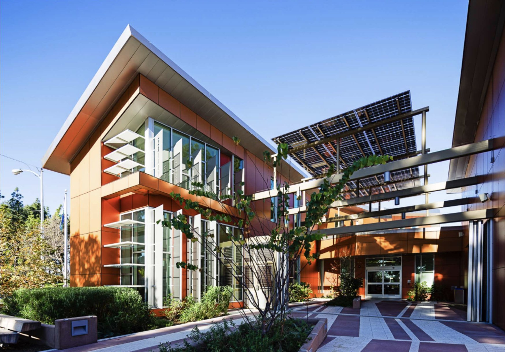 Pico Rivera Library entrance with a glass facade, angular roof and courtyard