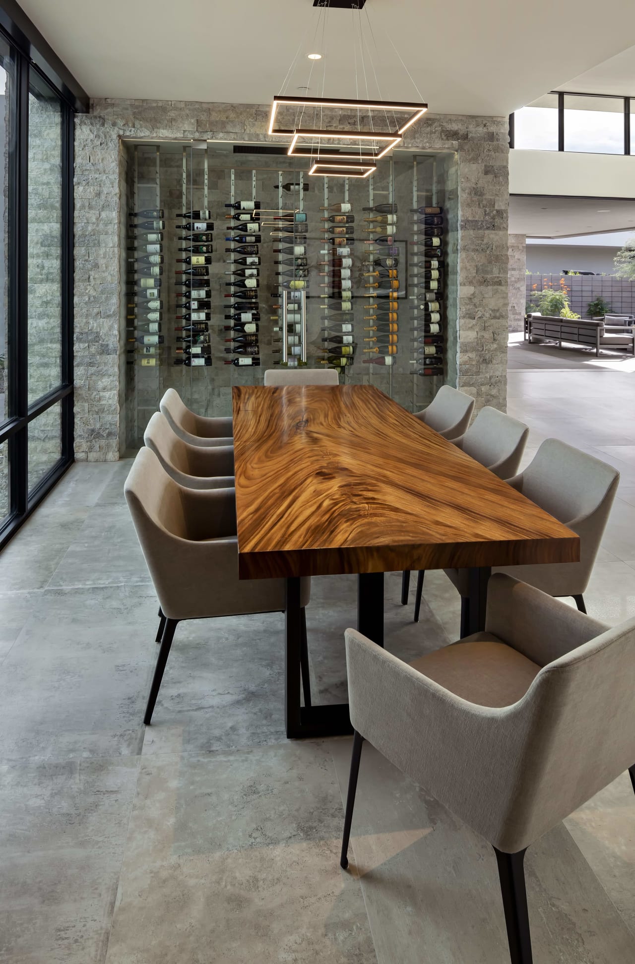 Custom wine rack and dining room in modern estate