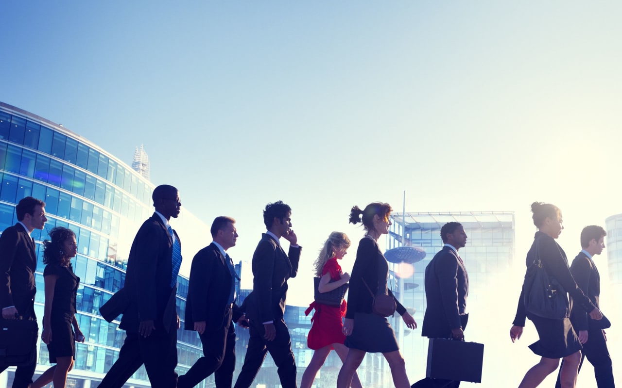 corporate employees walking outside the building