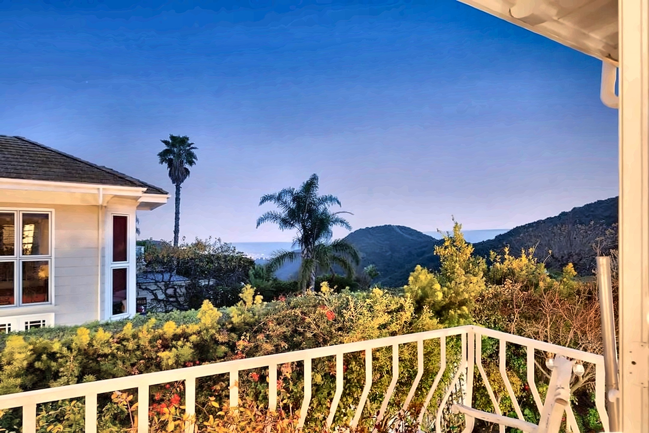 Balcony with canyon and ocean views from a Brentwood Mountaingate estate