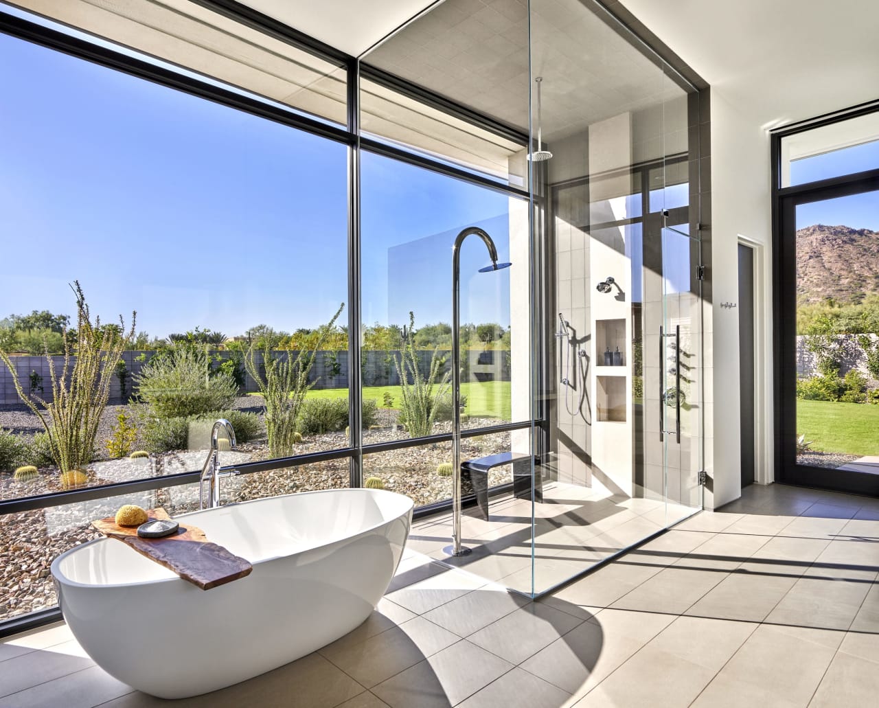 All glass bathroom in modern luxury home with natural light