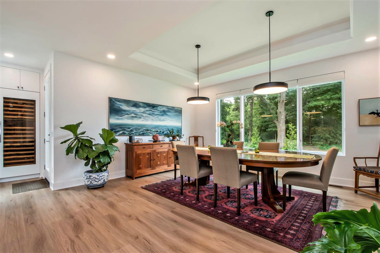 dining area with wooden table and chairs and pendant lightings